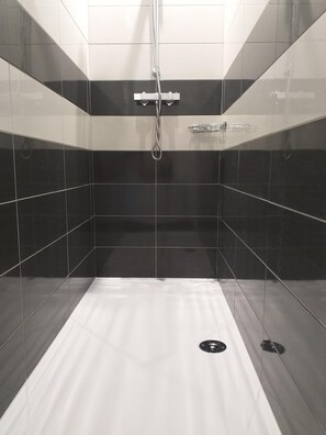 Shower, hair dryer, towels, toilet paper