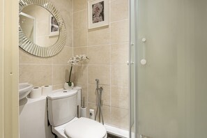 Apartment, 1 Queen Bed | Bathroom | Shower, free toiletries, hair dryer, towels