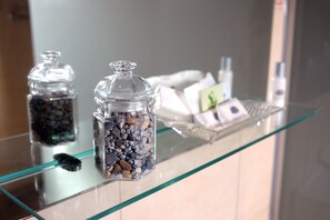 Reflective surfaces and decorative accents add a touch of modern style to this well-maintained space.