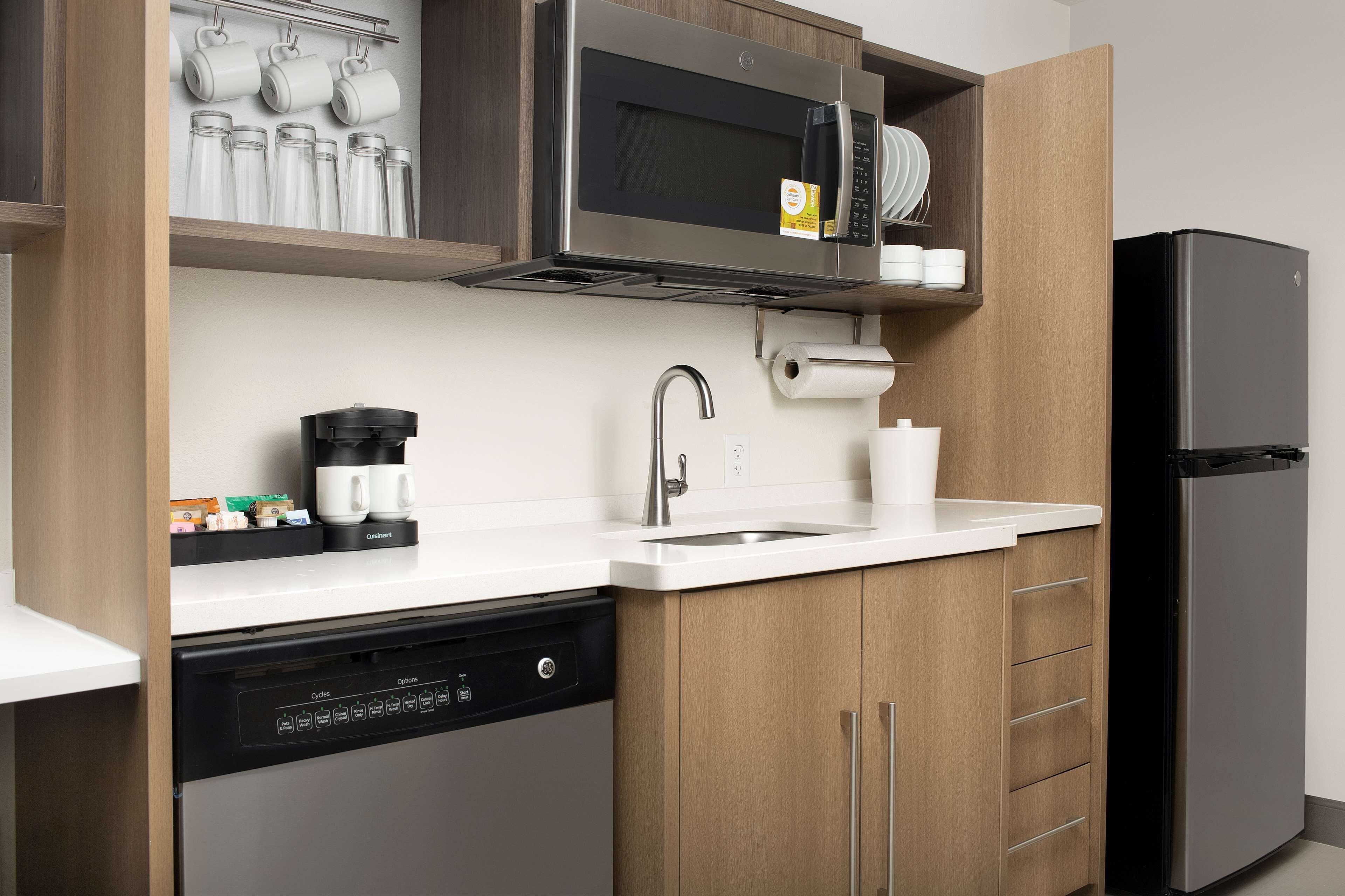 full-sized fridge, microwave, dishwasher, coffee/tea maker