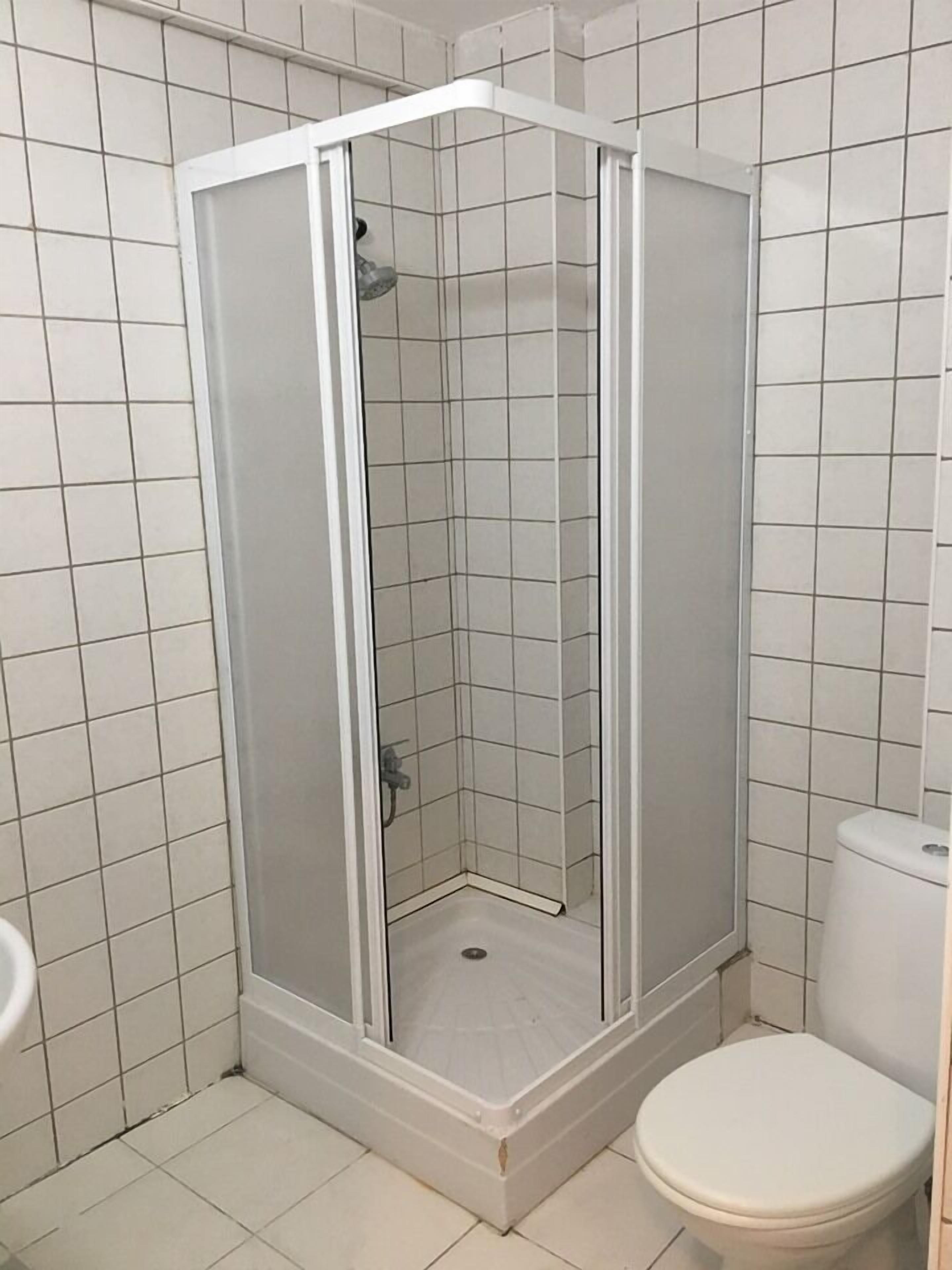 Shower, free toiletries, slippers, towels