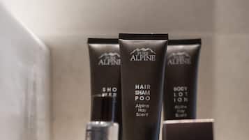 Three Alpine body care products on a tray.