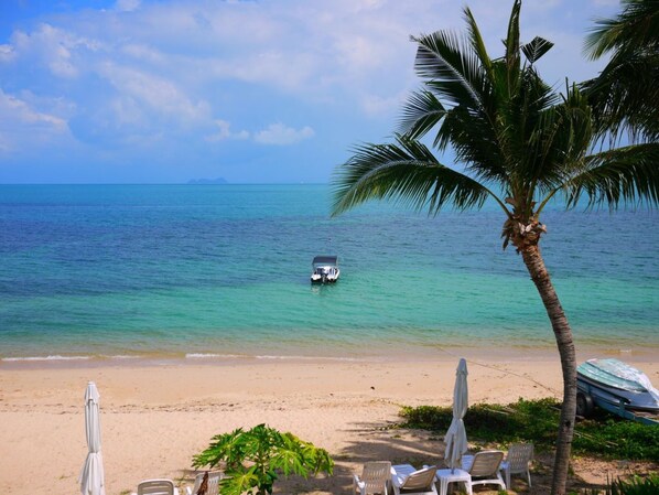 On the beach, sun loungers, beach towels