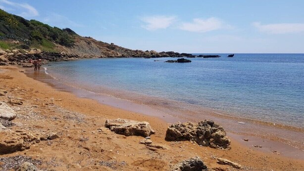 A sandy beach with rocky outcrops and calm water. - crotone house via S Leonardo (Crotone)