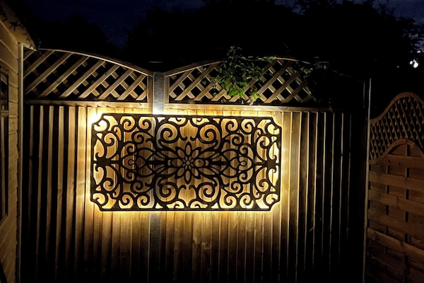 rear garden features solar lights on the fencing screens.