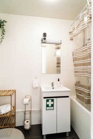 Hair dryer, towels, soap, shampoo