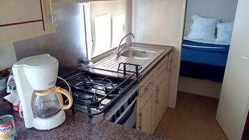 Full-sized fridge, microwave, stovetop, coffee/tea maker