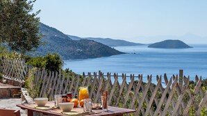 A table with breakfast items and a view of the sea. - Villa Glikeria, W/pool, Lovely Sea Views And Close To Everything (Glossa)