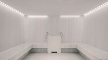 Um banheiro moderno e minimalista, com área de chuveiro central, bancos ao longo das paredes e iluminação embutida.
