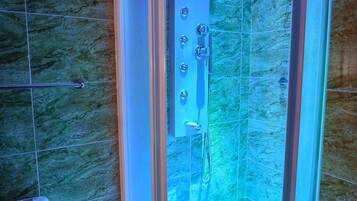 Shower, hair dryer, towels, shampoo