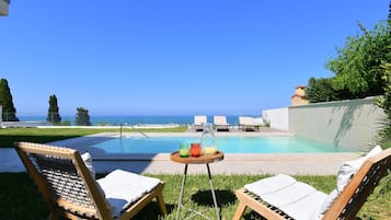 Outdoor pool, pool umbrellas, pool loungers