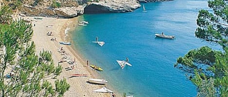 On the beach, sun-loungers