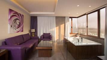 Deluxe Suite, Jetted Tub | In-room safe, blackout drapes, free WiFi, bed sheets