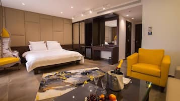 Deluxe Suite, Jetted Tub | In-room safe, blackout drapes, free WiFi, bed sheets