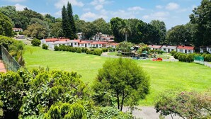 A residential area with houses, a playground, and a well-maintained lawn. - Club Santa Maria (Cuernavaca)