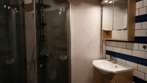 Shower, towels, soap, toilet paper