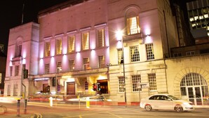 A historic building with large windows and a prominent entrance. - Manchester Hall (Manchester)