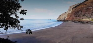 On the beach, sun loungers, beach towels