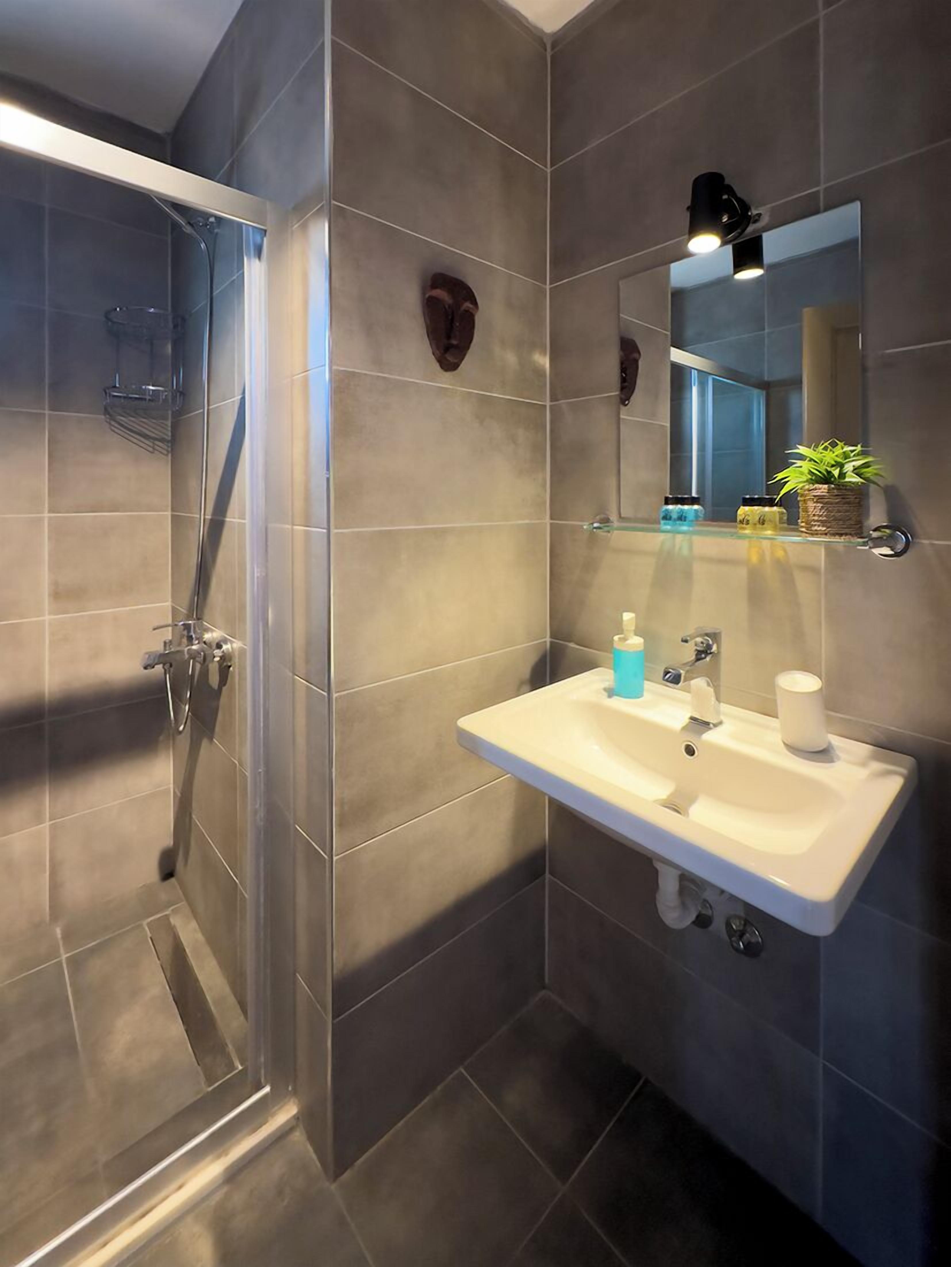 comfort double room, garden view | bathroom | shower, free toiletries, hair dryer, slippers