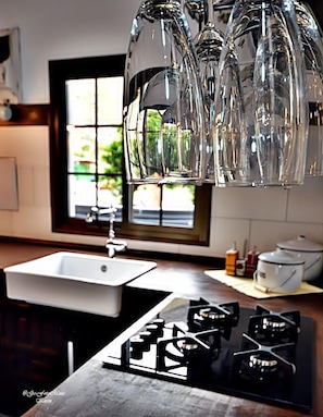 Enjoy cooking in this well-equipped kitchen with a central island and gas stove.