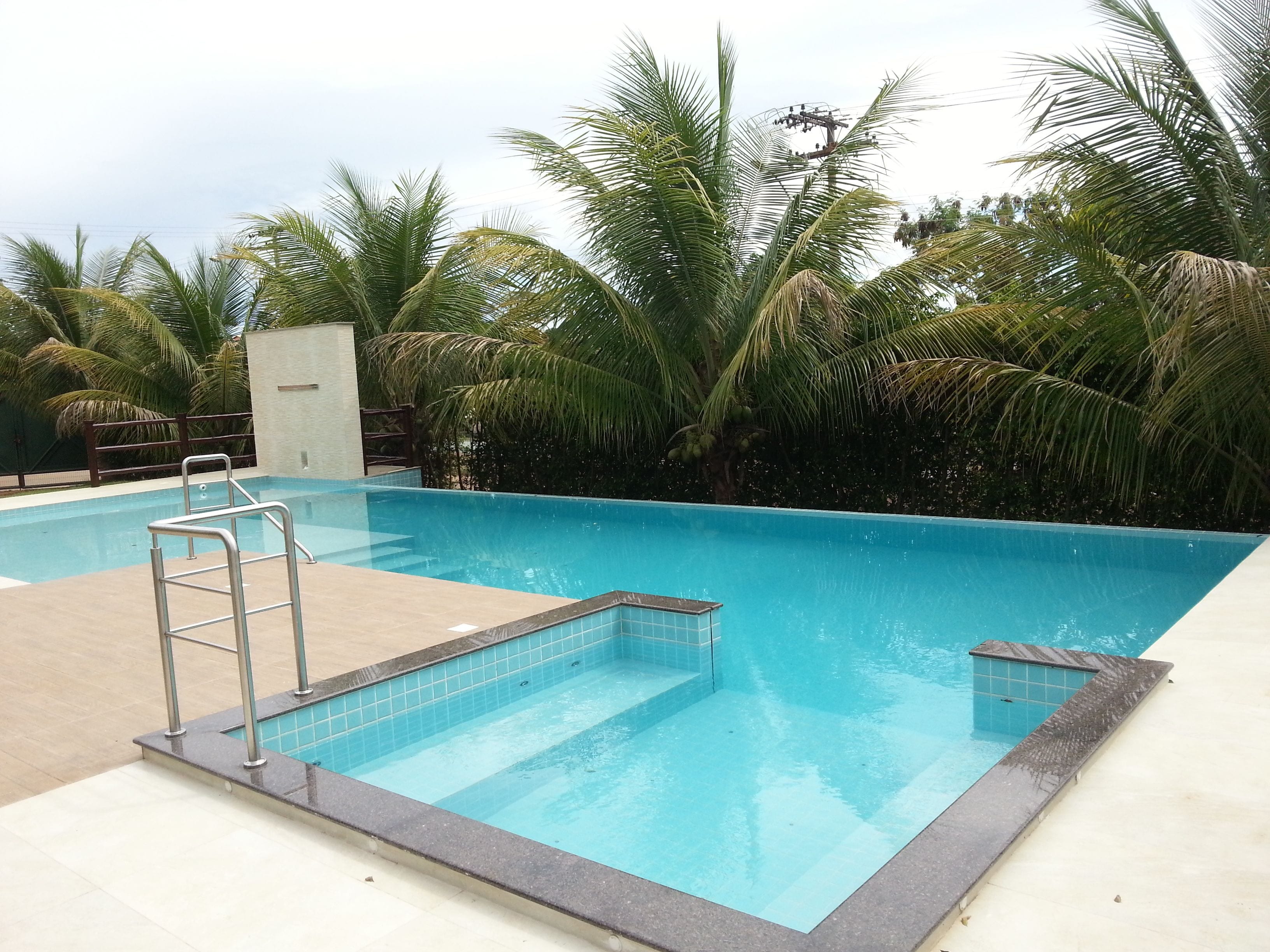 Outdoor pool, open 7:00 AM to 10:00 PM, pool umbrellas, pool loungers