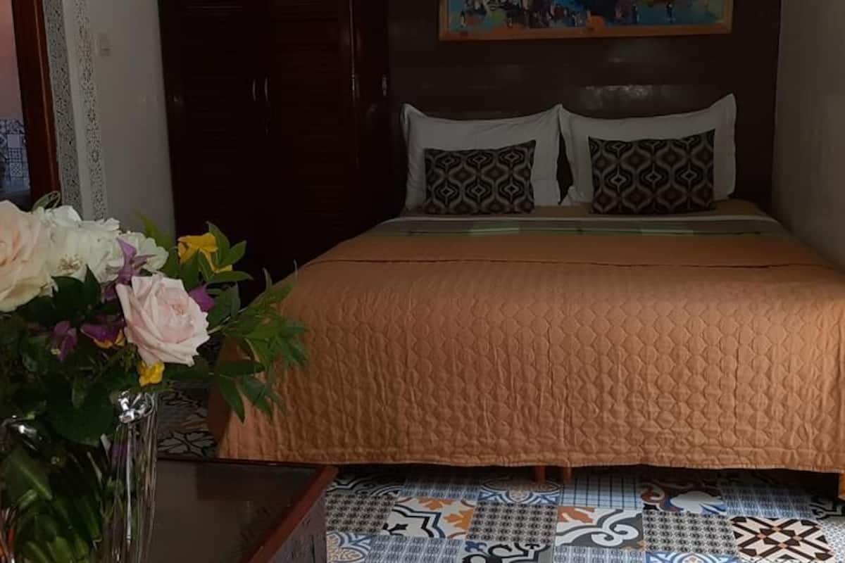 Premium bedding, laptop workspace, iron/ironing board