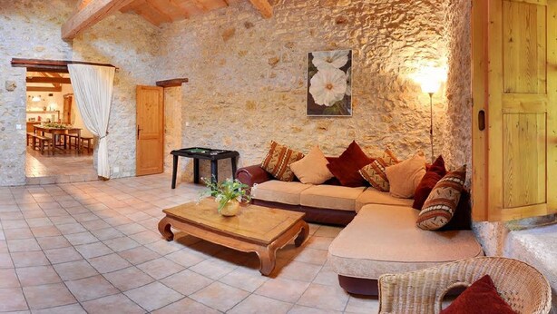 A rustic interior with stone walls, wooden beams, a sofa set, a coffee table, and a billiards table. - Charming cottage for 12 people - Wilderness + private pool (Thézac)