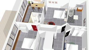 Distribución de una habitación de hotel con cama, escritorio, silla, mesita y sofá.