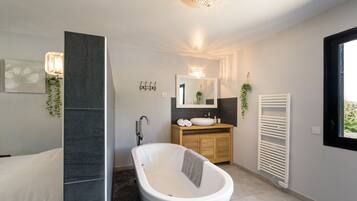 Bathtub, hair dryer, towels