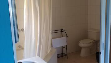 Bathtub, towels, toilet paper