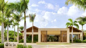 Un bâtiment moderne abritant un spa, avec une enseigne indiquant : « Le Spa ».