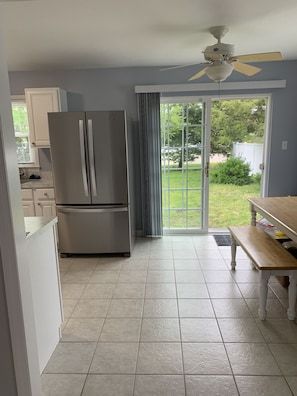 Enjoy meals at the refrigerator and dining table with bench.