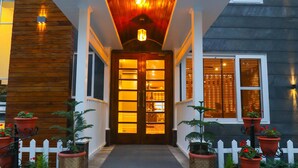 A house with a wooden facade, a white picket fence, and a set of steps leading to a door with glass panels. - The Retreat Mashobra, Shimla (Shimla)