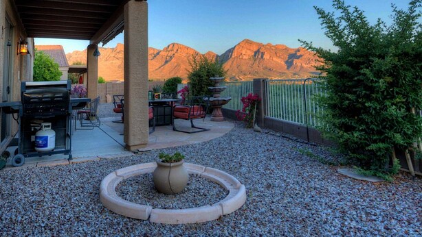 A patio with outdoor furniture, a gas grill, and a decorative planter. - Mountain Calling spectacular views/ Spacious 3 BR Home/ Oro Valley/ Tucson (Tucson)