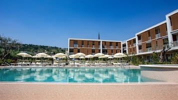 Seasonal outdoor pool, pool umbrellas, sun loungers