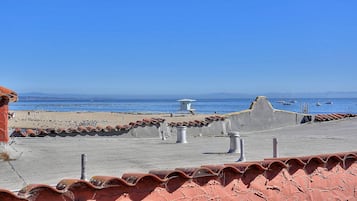 On the beach, sun loungers