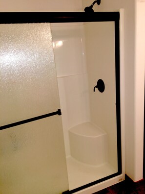 Combined shower/tub, hair dryer, towels, soap - The Treehouse Townhouse (Cloverdale)