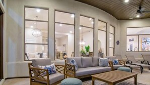 A modern living room with a sofa, ottomans, and a coffee table. - CAMELBACK MT BEAUTY PARADISE VALLEY SCOTTSDALE AREA (Paradise Valley)