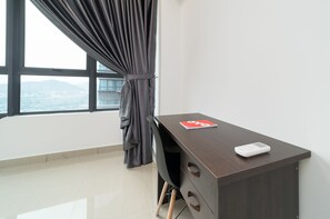 Enjoy a city and mountain view from the large window in this stylish room.