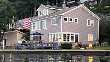 Enjoy waterfront dining and socializing with scenic views from this charming building's outdoor seating area and dock.