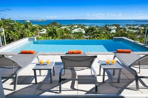 An infinity pool, a heated pool - Luxurious Orient Bay Villa with Spectacular Views (St Martin)