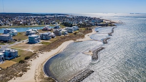 A coastal residential area with houses near a beach and a body of water. - Only 1 Block to the Beach - Community Pool - Featured on HGTV!  (Cape Charles)