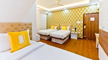 Deluxe Triple Room | In-room safe, bed sheets