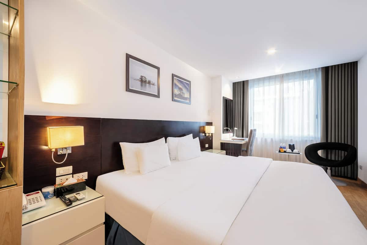 Deluxe Suite Double | Minibar, in-room safe, blackout drapes, iron/ironing board