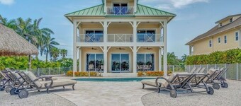 W09 - New Luxury Property! Breathtaking Canal Front Pool Home - Sleeps 14