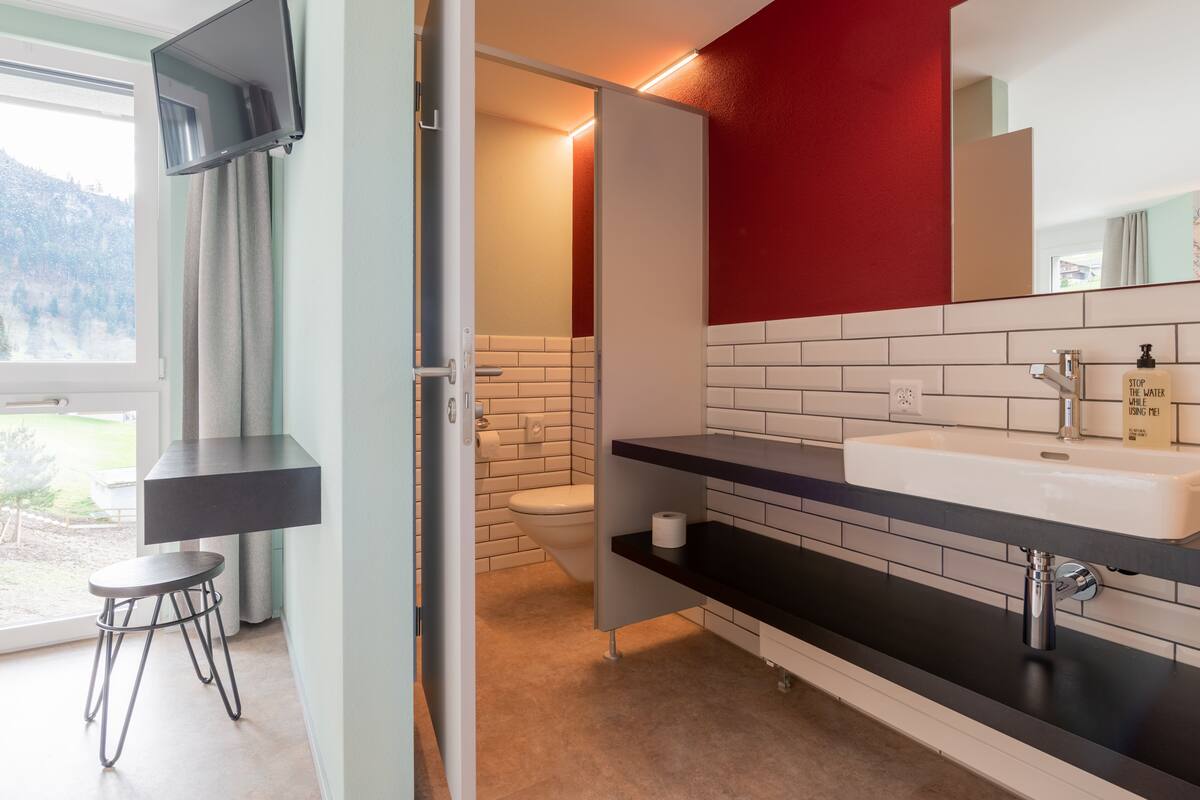 junior suite | bathroom | shower, hair dryer, towels, soap