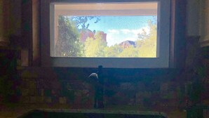 A kitchen with a window, sink, and a view of trees and mountains. - Main house in the heart of Sedona (Sedona)