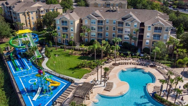 A resort with a large pool, a water park, and multiple apartment buildings. - Windsor Orlando Arcade Room, Movie Theater, Pool & Hot Tub, King Bed, Bunk Bed (Kissimmee)