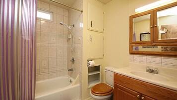Bathtub, hair dryer, towels, soap