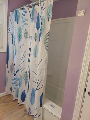 Combined shower/bathtub, hair dryer, towels, soap - Family Home, walk to Downtown Overland Park! (Overland Park)